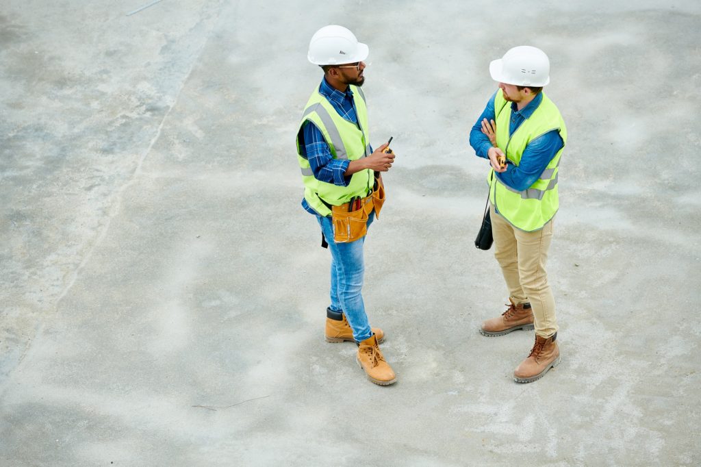 Engineers speaking on construction site