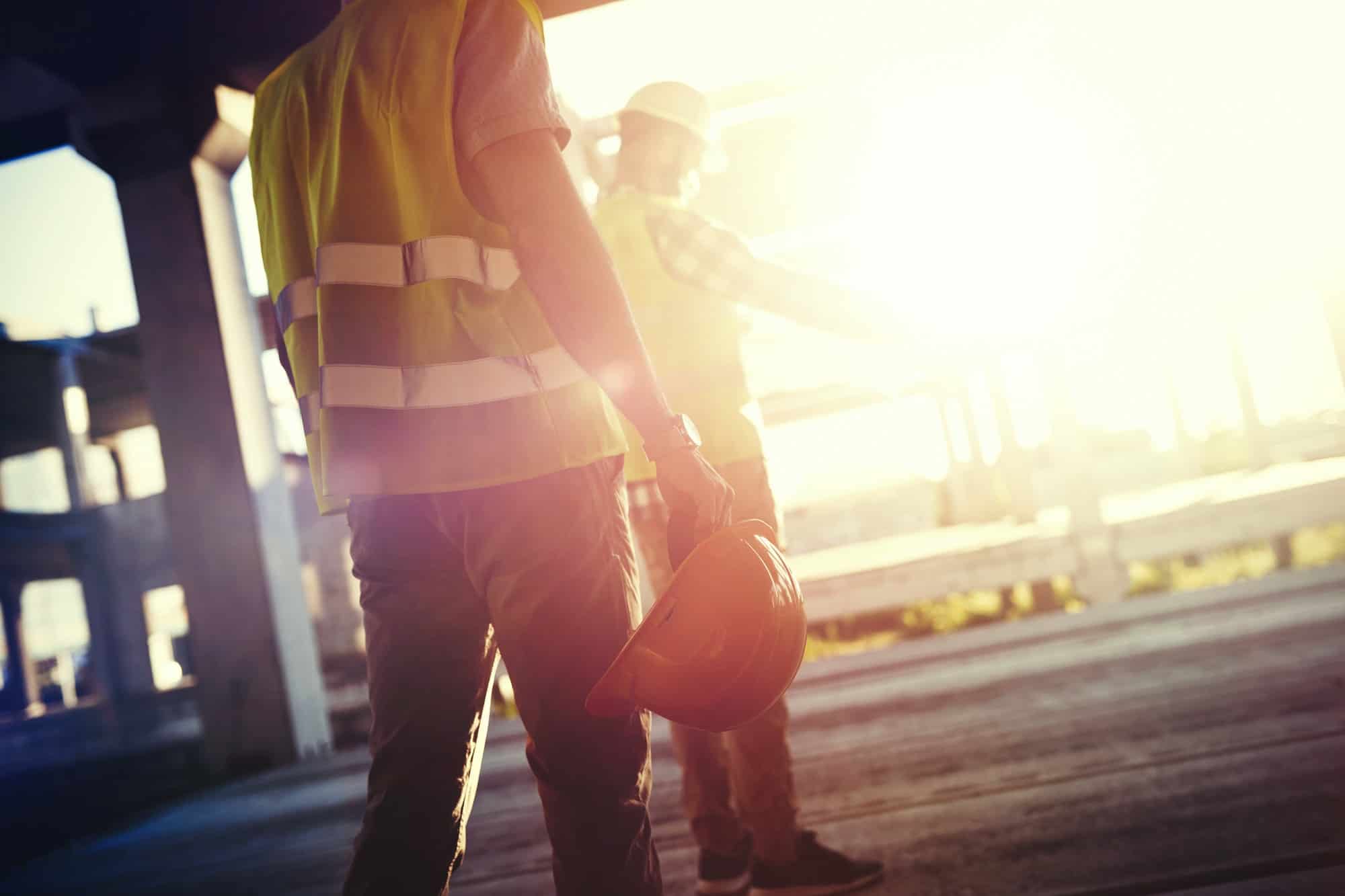 Portrait of construction engineers working on building site